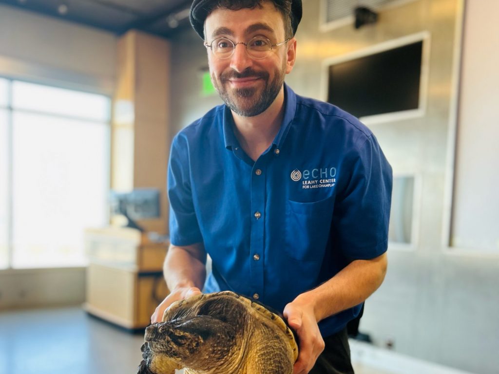 Animal Care staff holding snapping turtle